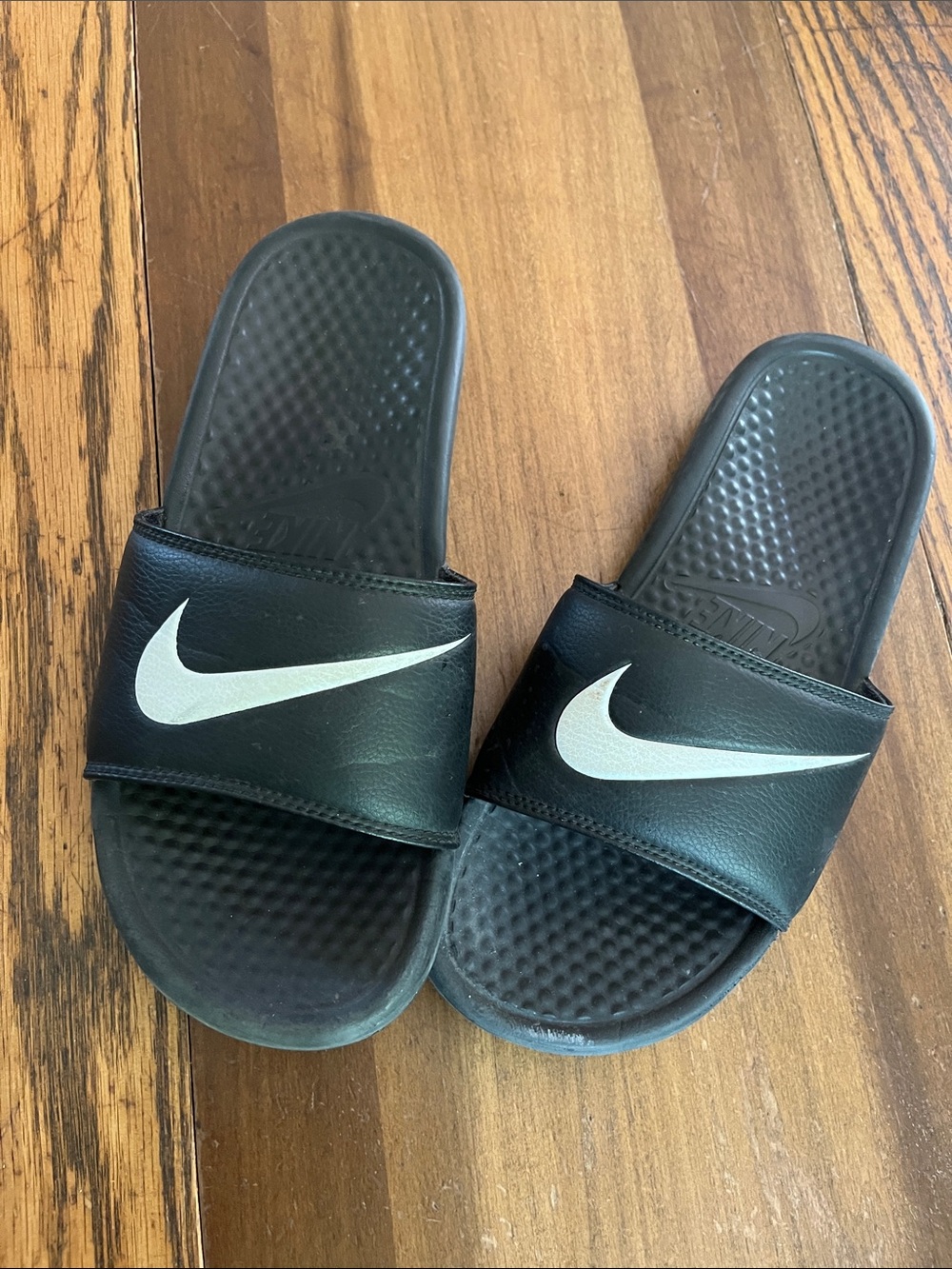 Nike Black Slides with White Swoosh Logo